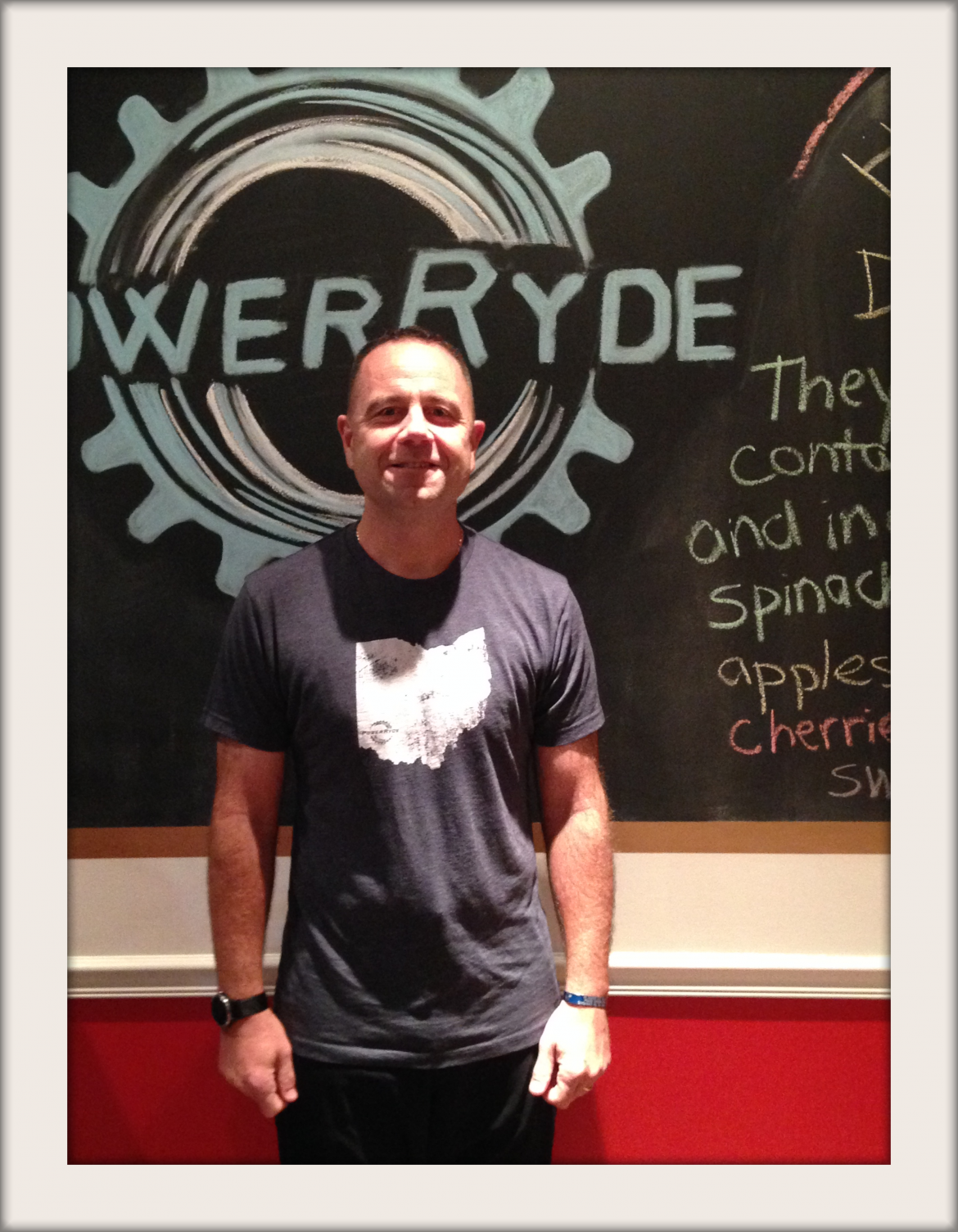 John Pavia in front of chalk PowerRyde logo
